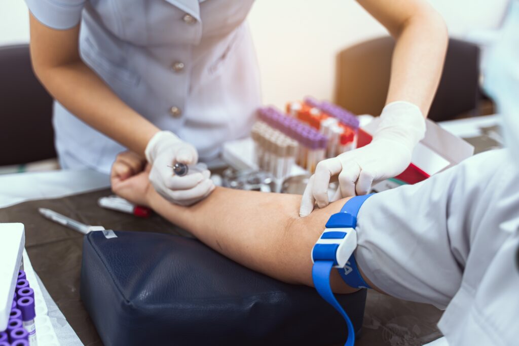 nurse taking patients blood